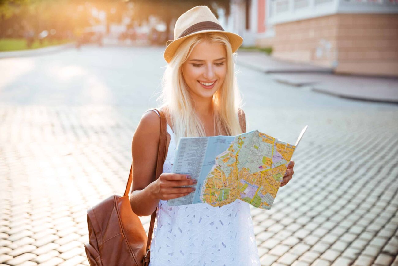 Female tourist using a map