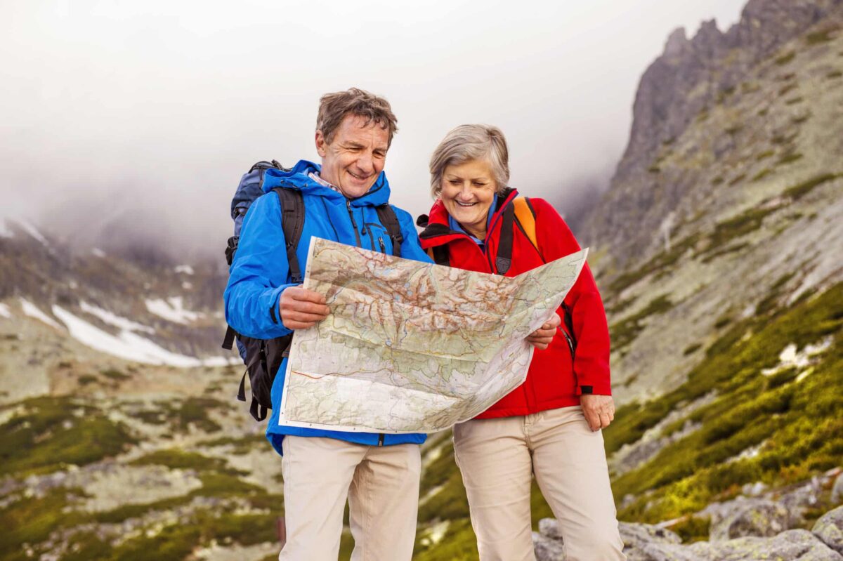 Senior tour guide on mountain path